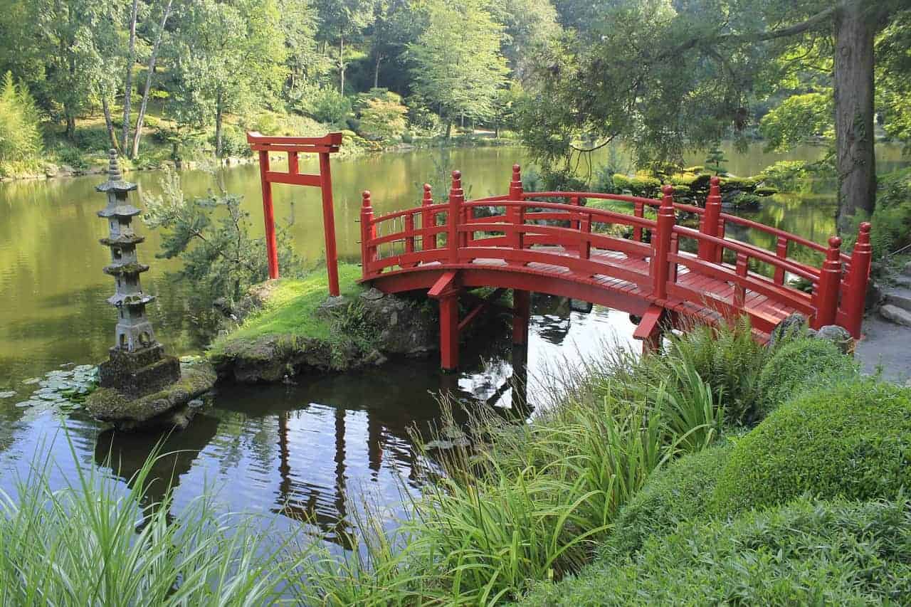 red japanese bridge in garden
