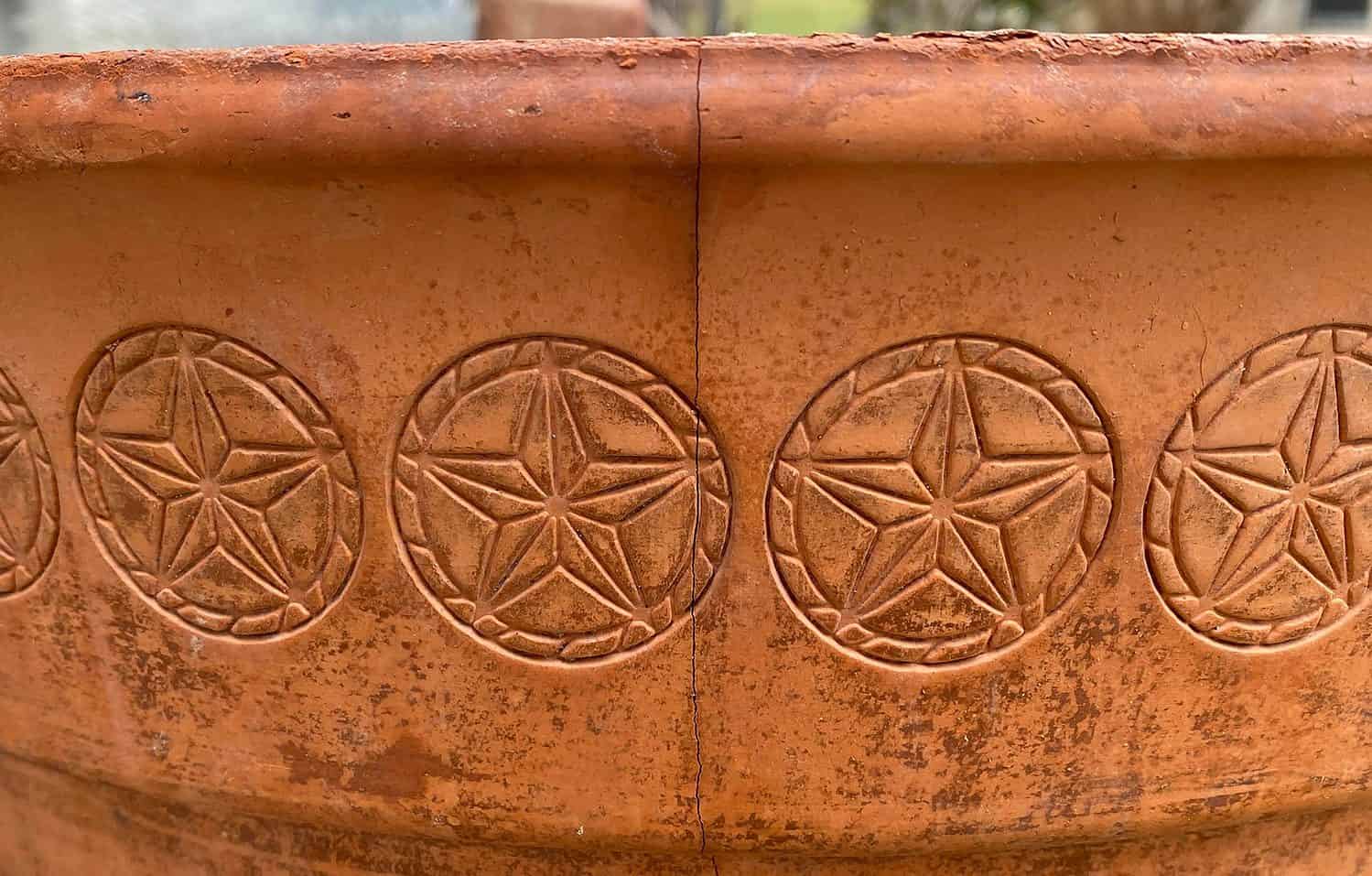 cracked terra cotta pot from winter weather