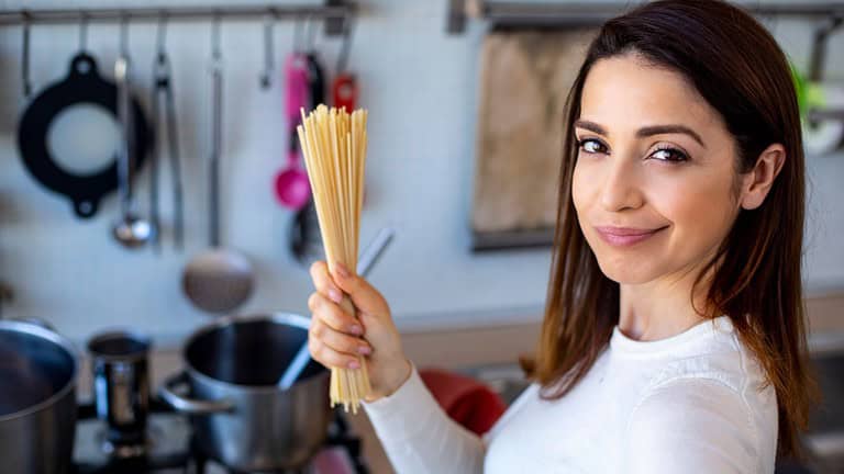 woman holding pasta