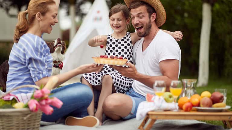 Family picnic in the backyard on beautiful day