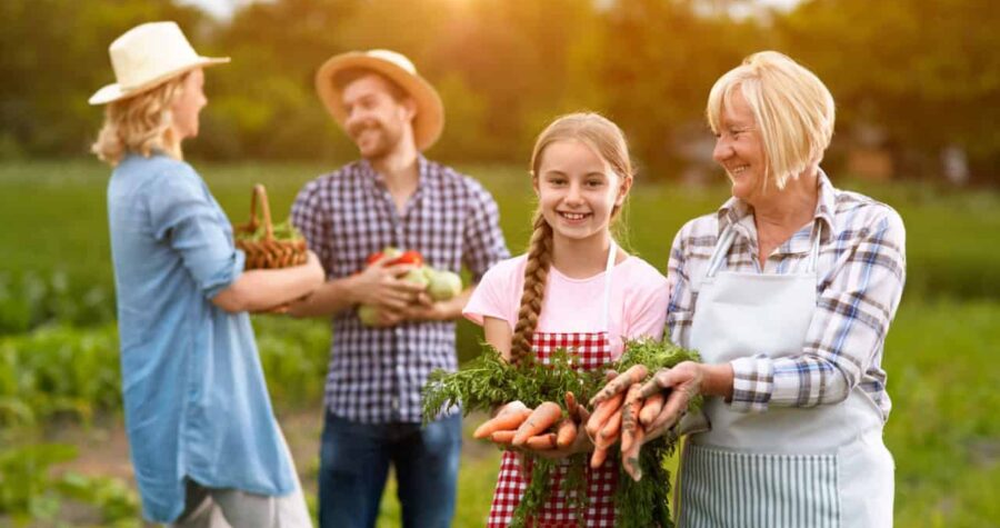 Satisfied rural family with own produced vegetables