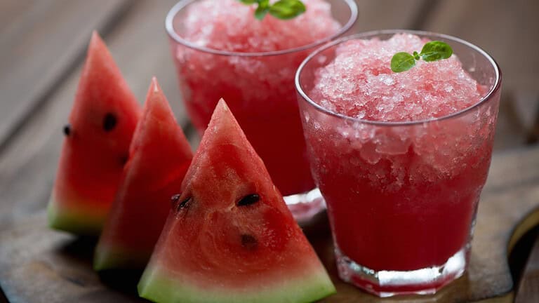 Glasses,With,Watermelon,Granitas,And,Fresh,Watermelon,Slices