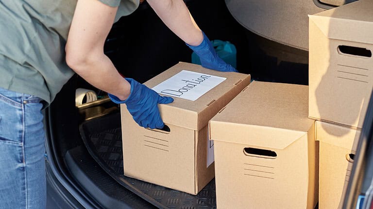 Donation box in car trunk for safe transportation into donation centers