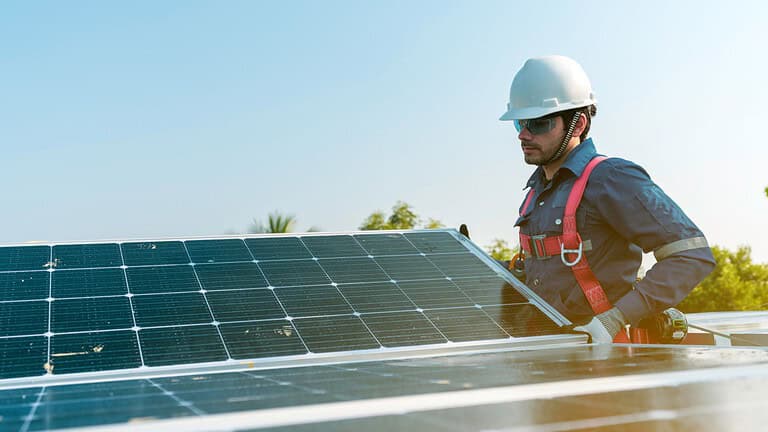 solar panels. man installing solar panels, energy efficiency