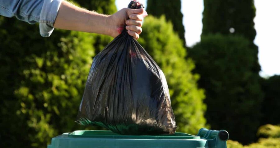 man throwing out garbage, garbage bag, throwing out trash