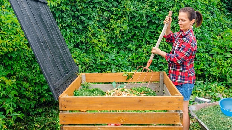 woman composting, composting, sustainability, eco-friendly