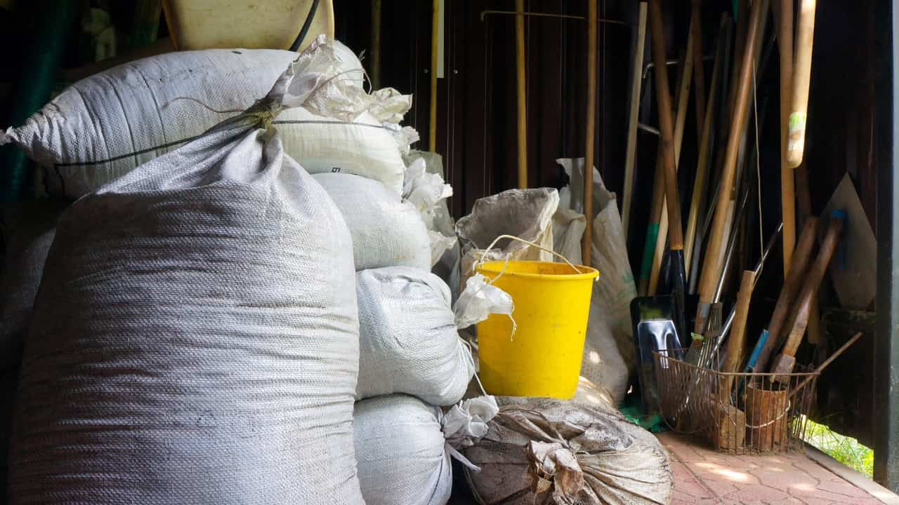 Cluttered shed which is also disorganized