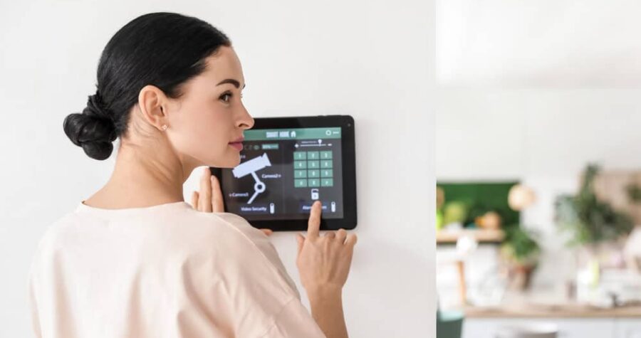 A person using a smart home security system, controlling a device on a smart home control panel, adjusting settings, interacting with technology, managing smart home features