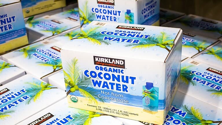 Kirkland organic coconut water, stacked boxes, tropical packaging design, labeled "Not from concentrate," Costco brand, hydration product,