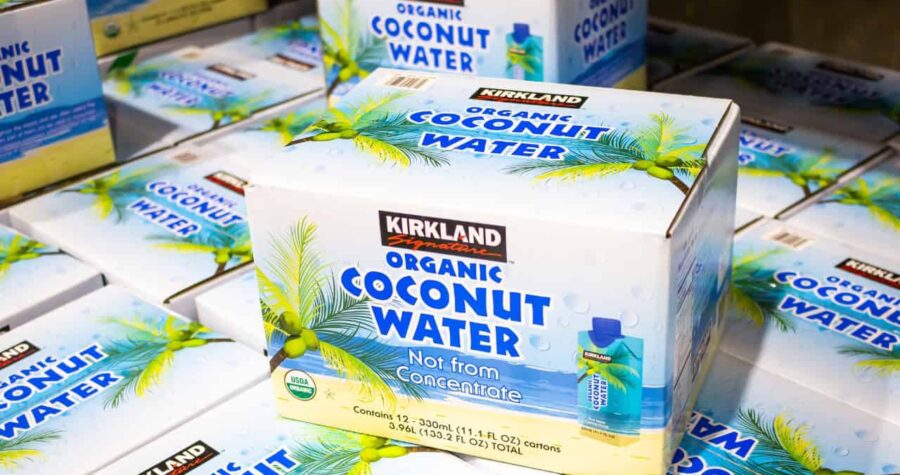 Kirkland organic coconut water, stacked boxes, tropical packaging design, labeled "Not from concentrate," Costco brand, hydration product,