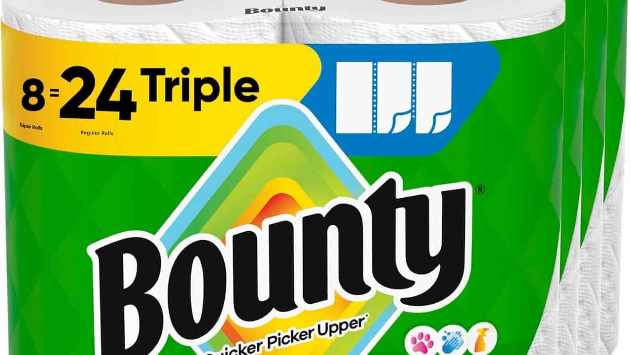 Bounty paper towels packaging, green and yellow design, "8 = 24 Triple" label, white paper towel rolls visible, brand slogan "The Quicker Picker Upper," icons for absorbency and household use