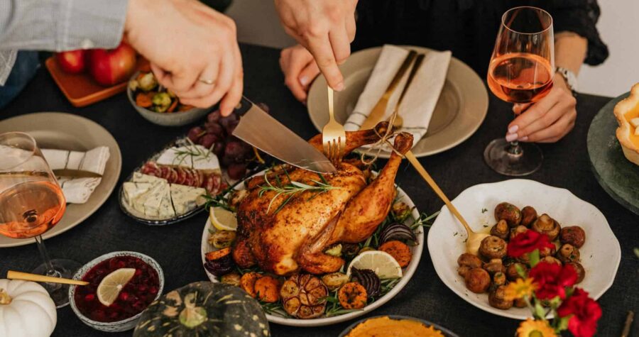 A delicious Thanksgiving dinner featuring roasted chicken and various side dishes