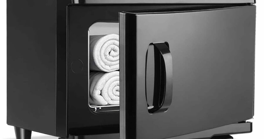 Black electric towel warmer, open door, rolled white towels inside, sleek design, countertop appliance