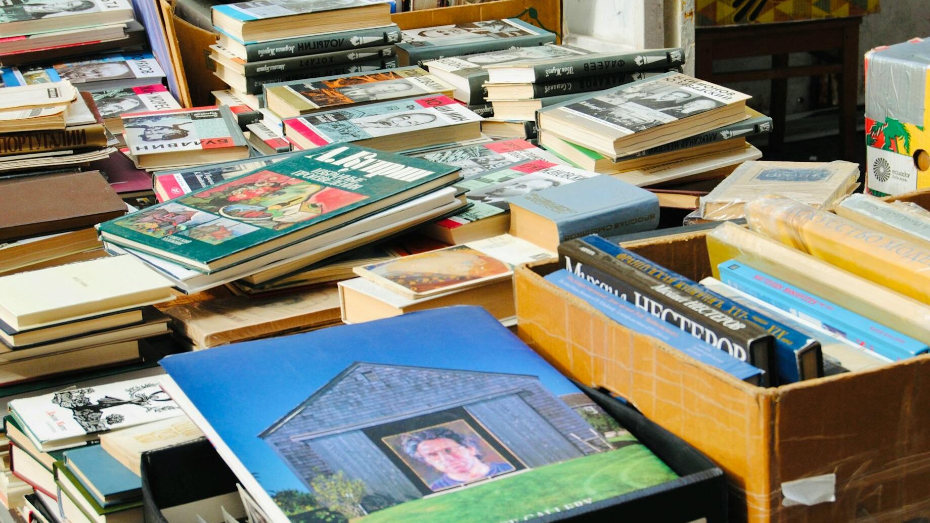 Vibrant collection of second-hand books displayed at a street stall in Moscow, Russia.