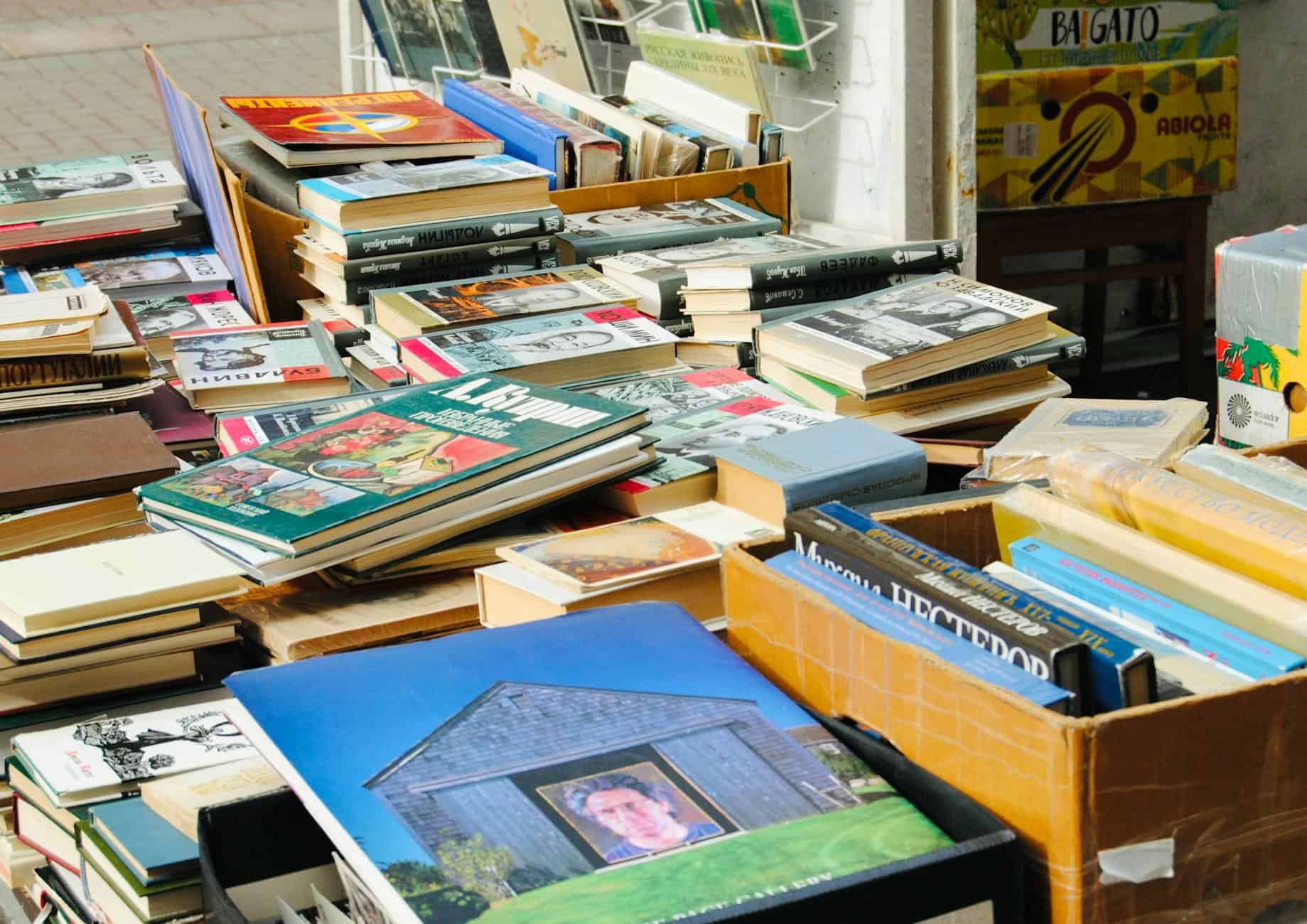 Vibrant collection of second-hand books displayed at a street stall in Moscow, Russia.