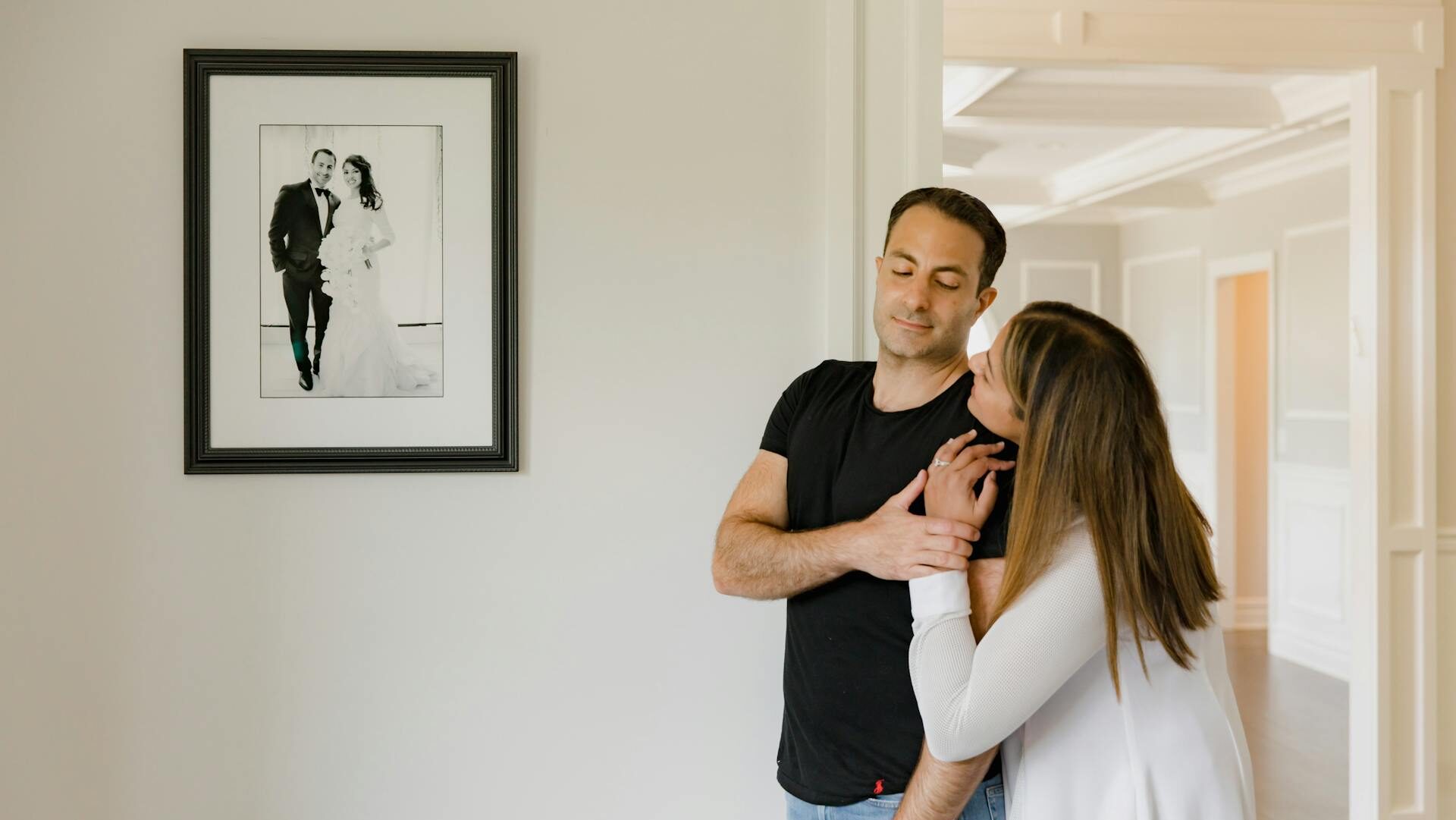 A Couple Smiling and Looking each other while Holding their Hands