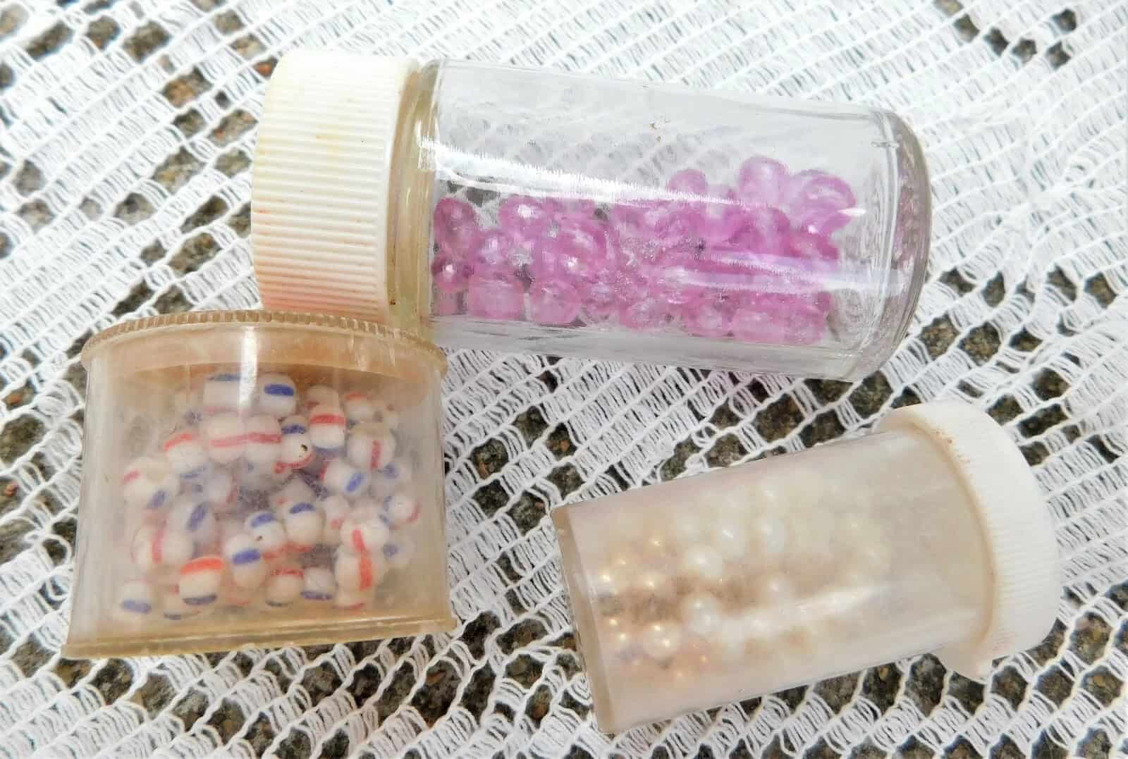18 OLD JARS and CONTAINERS OF VINTAGE BEADS OF ALL KINDS