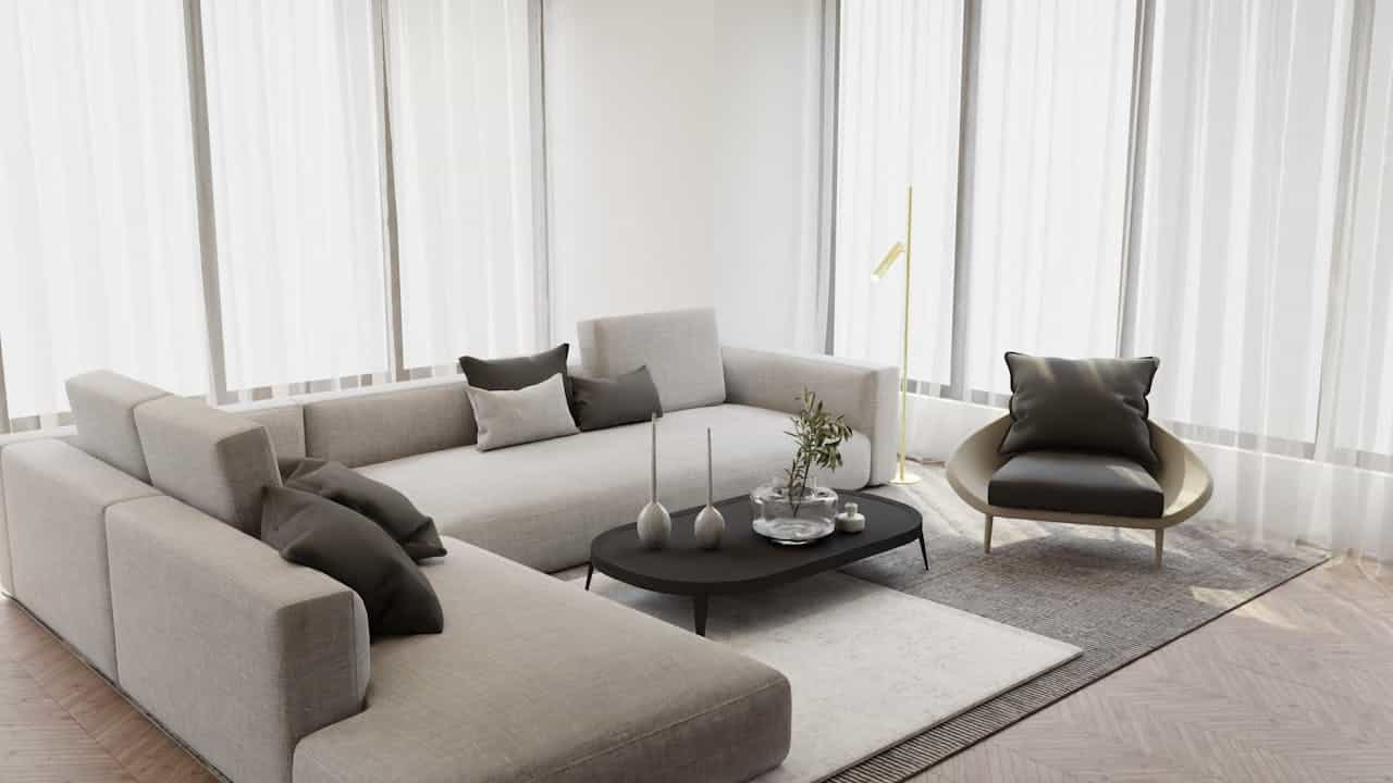 Minimalist living room with light gray L-shaped modular sofa, black coffee table, designer chair, and sheer white curtains on herringbone flooring