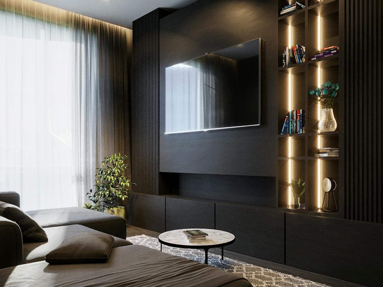 Modern living room with sleek design, large flat-screen TV mounted on a dark wall, bookshelves with dim lighting, potted plant in the corner, cozy sectional sofa with soft cushions, a marble coffee table on a patterned rug