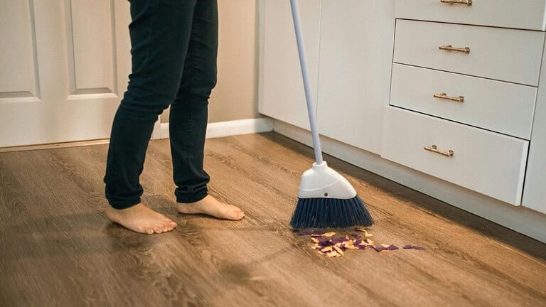 sweeping wood floor cleaning dust
