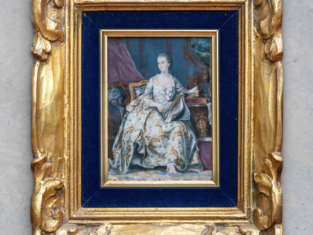 Miniature 19th-century portrait painting of a seated aristocratic woman in an ornate gold and blue frame
