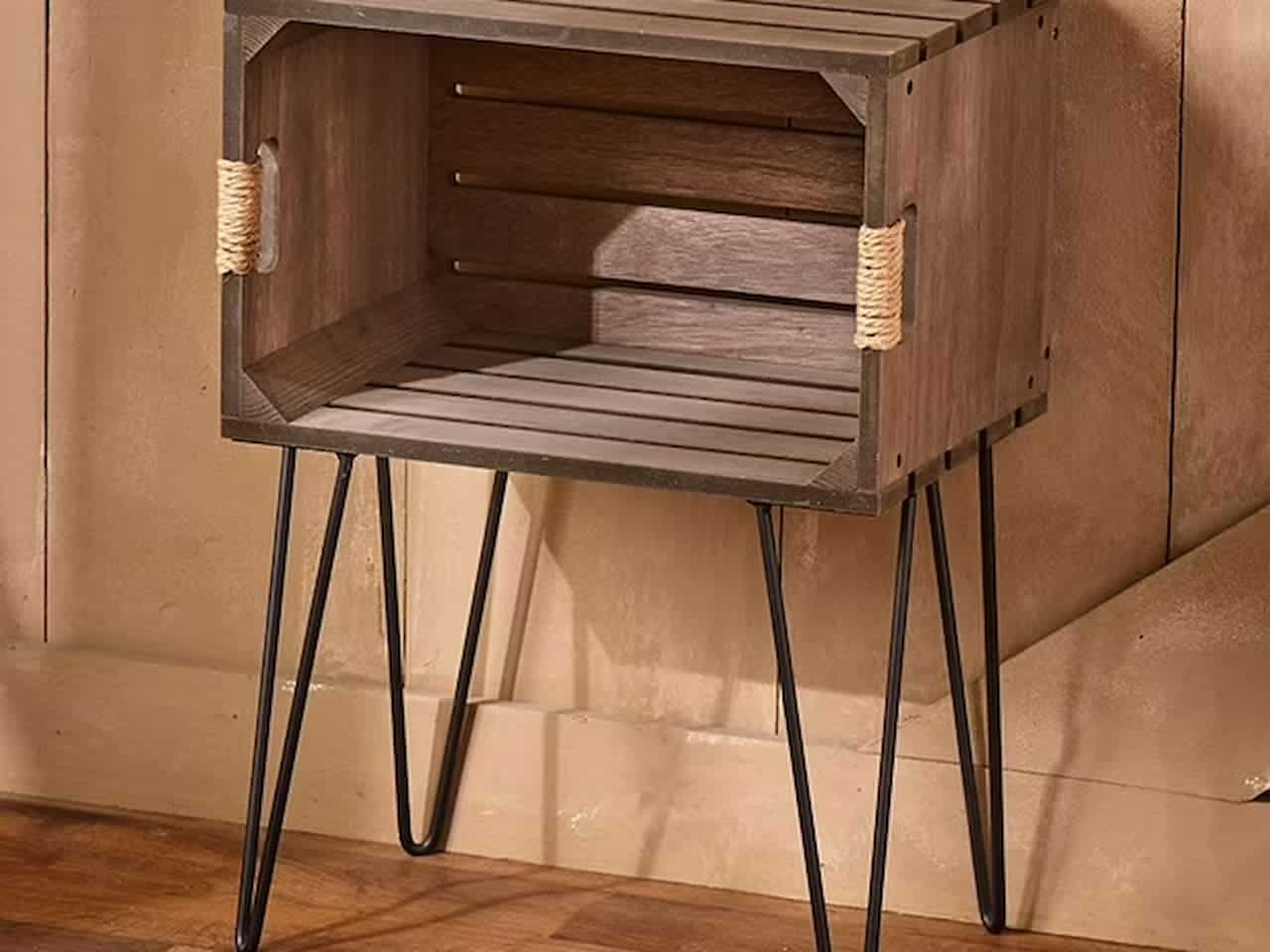  Rustic wooden crate end table with jute-wrapped handles on both sides, elevated by black metal hairpin legs