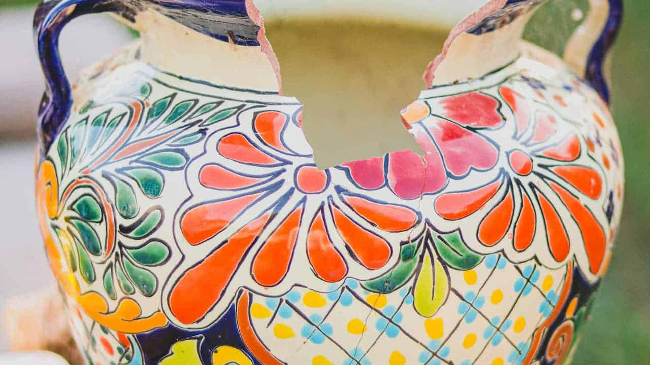 Broken ceramic pot, visible cracks 