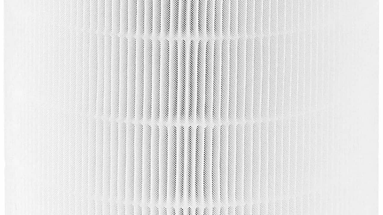 White air vent or filter grate with vertical slats in a square or rectangular frame