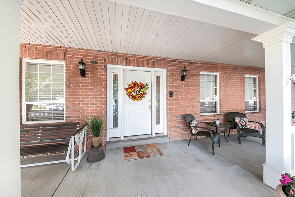 Front porch with bricks and white beadboard ceiling