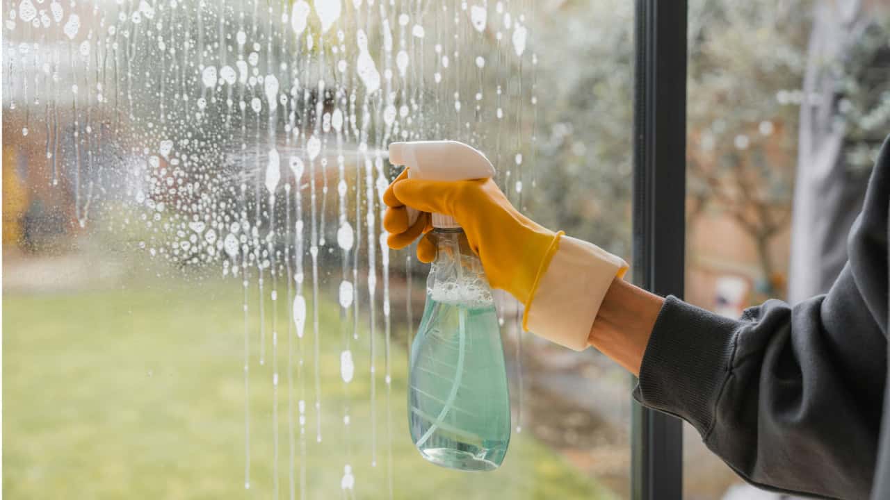 Cleaning windows in a home using window cleaner