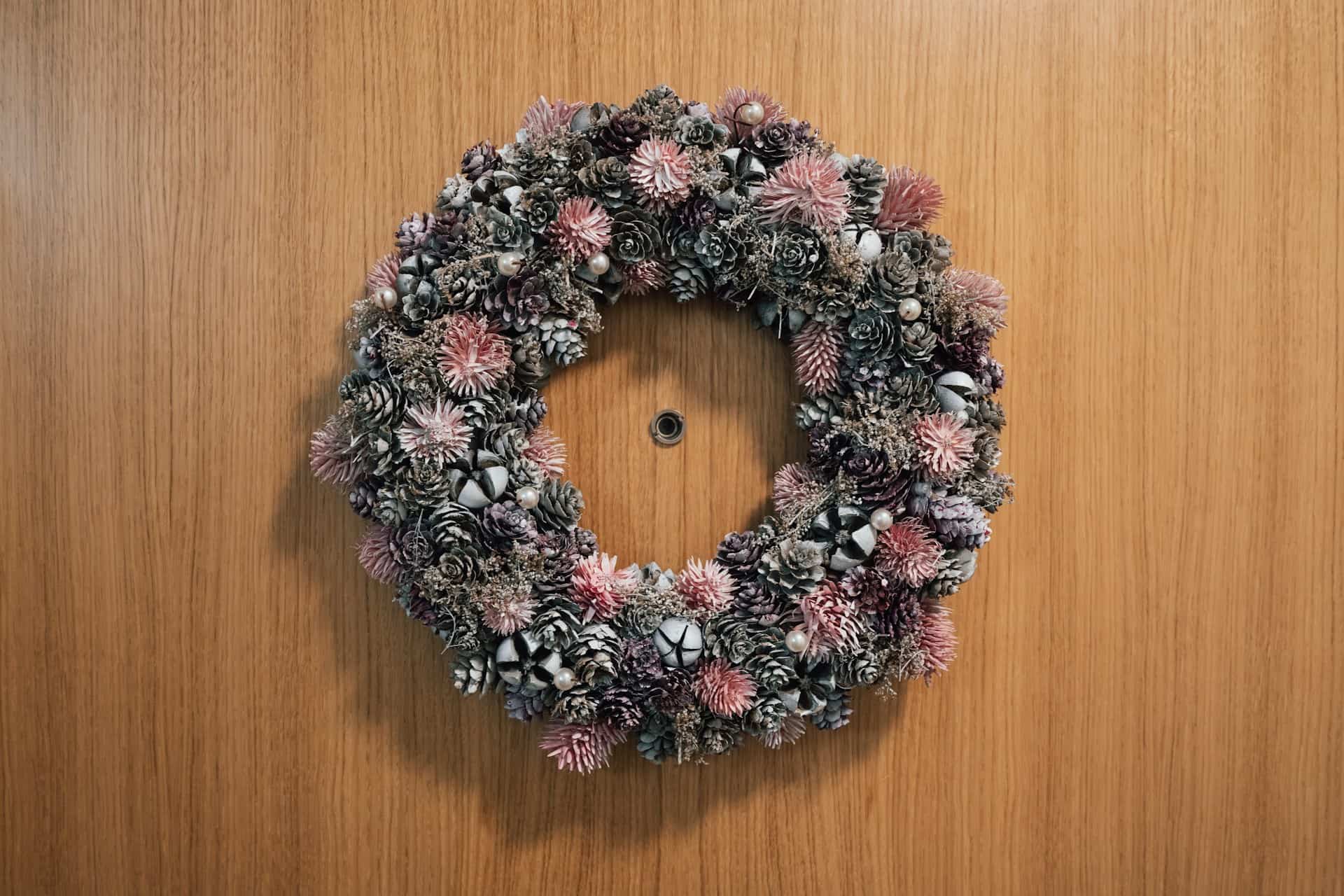 a-wreath-is-hanging-on-a-wooden-doo