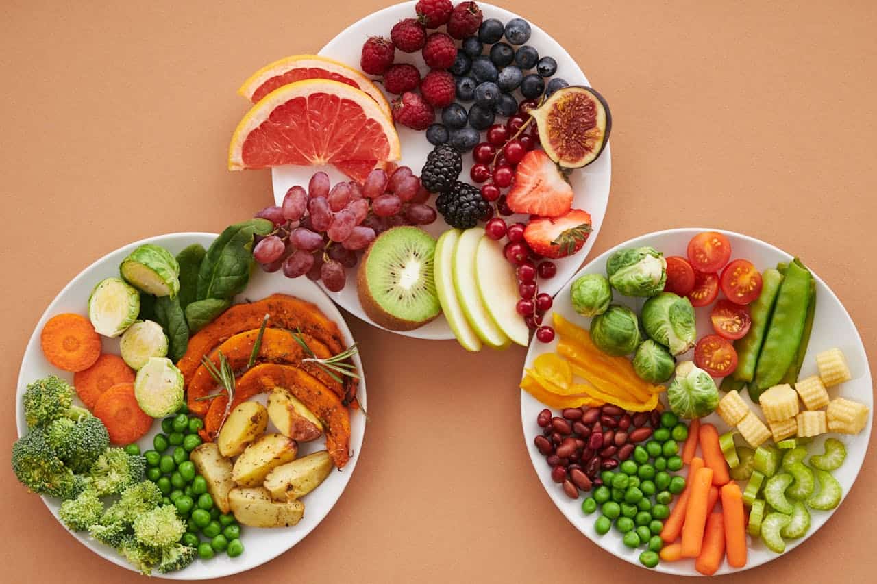Top View of Plates Full of Fruits and Vegetables
