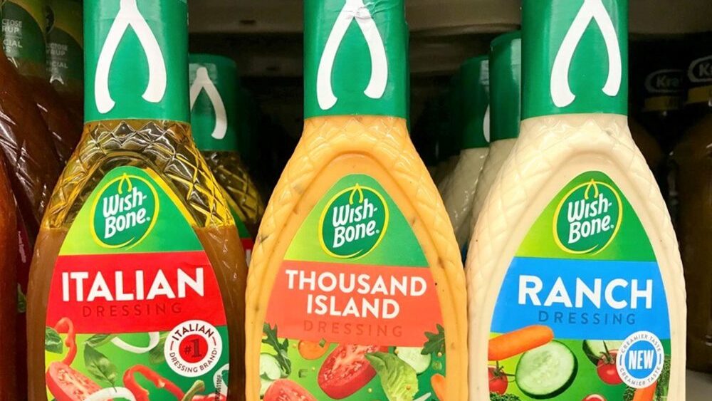 Wish-Bone salad dressings on shelf, including Italian, Thousand Island, and Ranch varieties, colorful labels, green caps