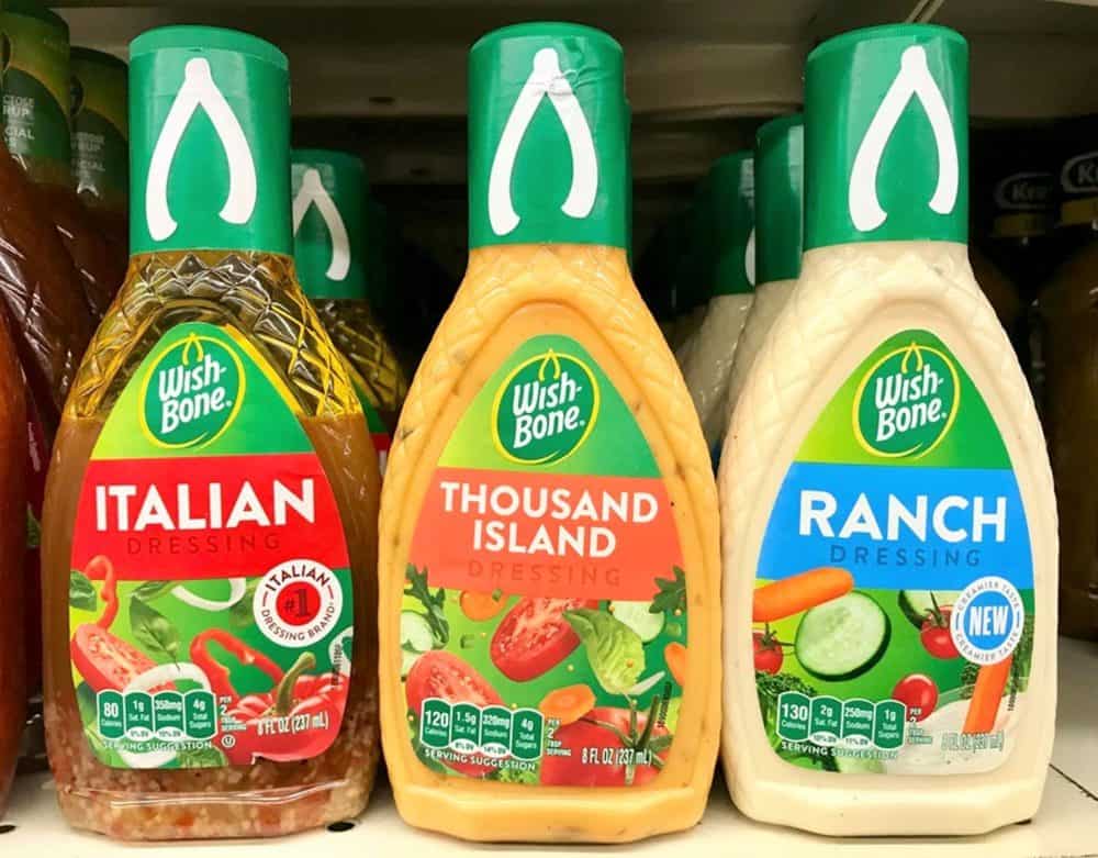 Wish-Bone salad dressings on shelf, including Italian, Thousand Island, and Ranch varieties, colorful labels, green caps