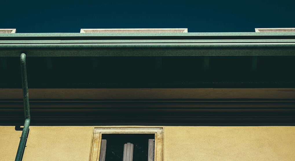 Old residential house facade in town on sunny day