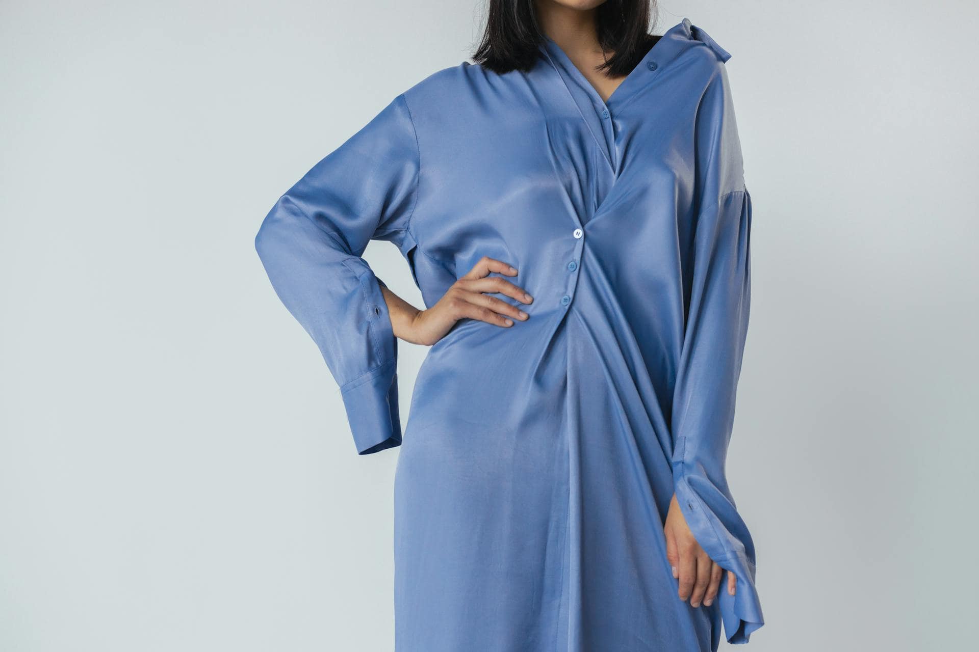 Person in Blue Silk Long Sleeve Dress Posing