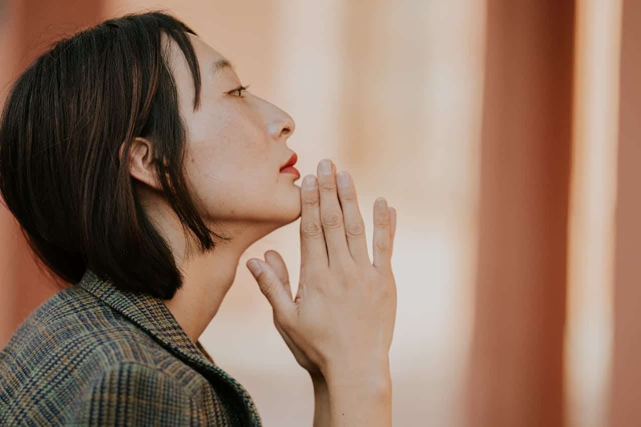 Profile Portrait of Woman in Thoughtful Pose