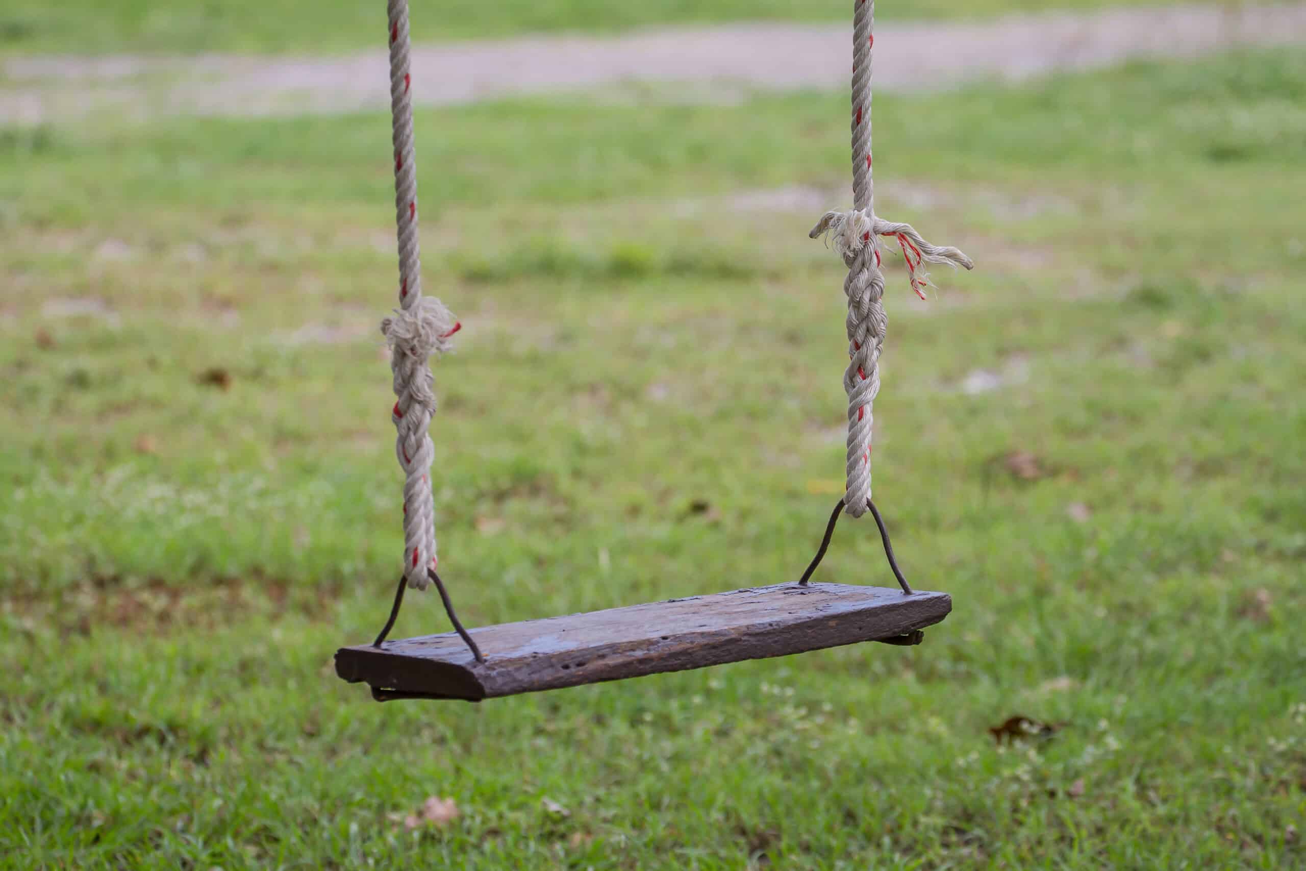 Wooden rope swing in the garden, for relax concept