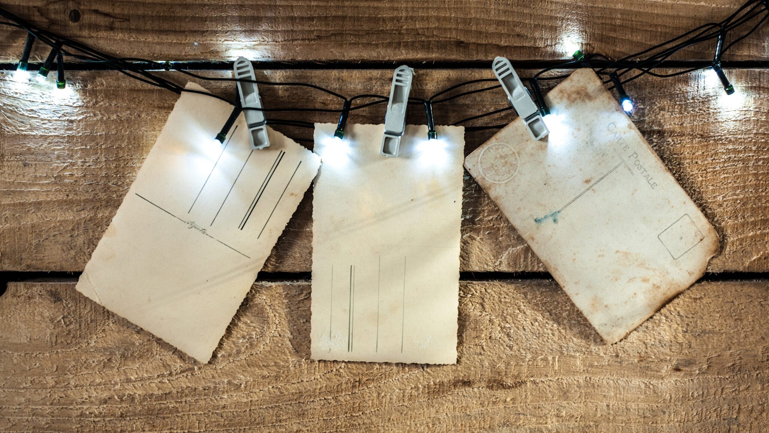 Happy New Year card with snow on wooden background